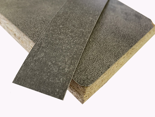 Кромочная лента ПВХ 0,4*19 мм BR110 с плитой ЛДСП 16 мм камень темный.